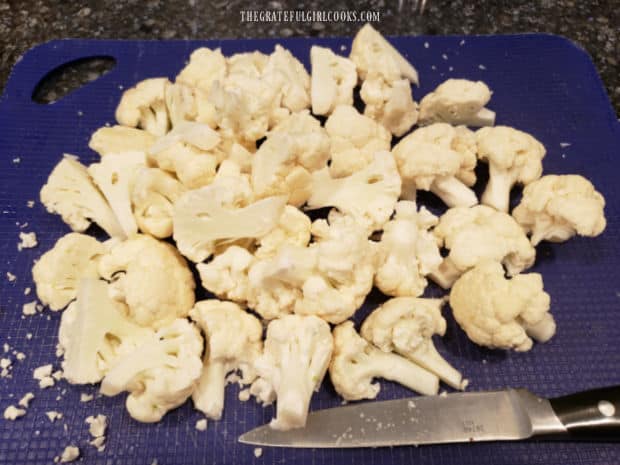 Florets from a cauliflower head are cut, and ready to cook for cauliflower au gratin.