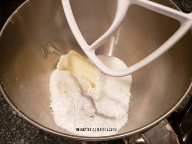 Shortening, butter, powdered and granulated sugar are beaten well until creamy.