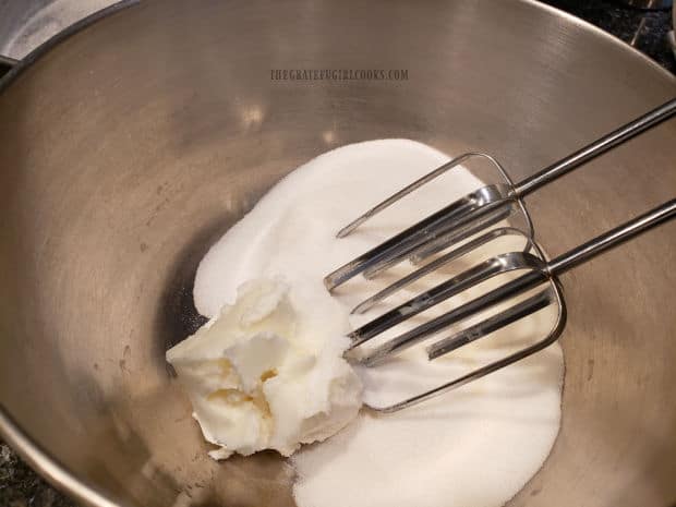 Granulated sugar and vegetable shortening are creamed together with an electric mixer.