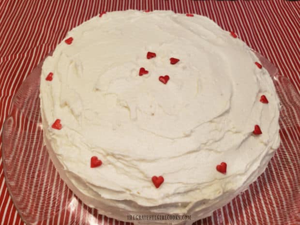 Grandma's red velvet cake is completely frosted and ready to slice and eat!