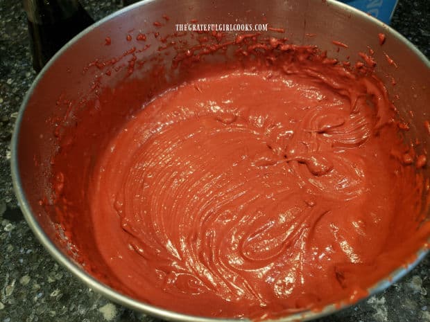 After adding more ingredients, the batter for Grandma's Red Velvet Cake is ready for baking.