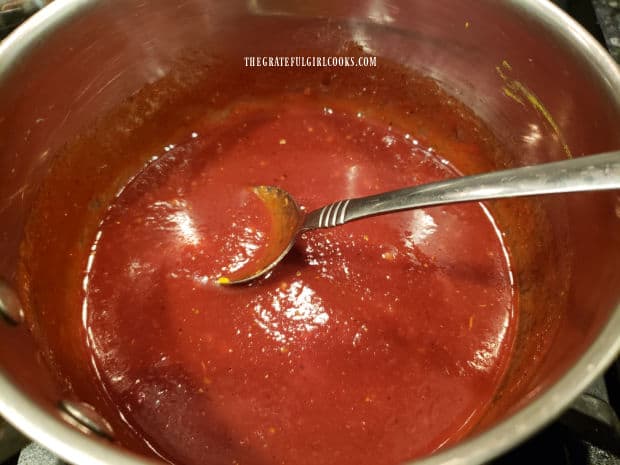 Homemade honey BBQ sauce is brought to a boil in pan, then is ready to use.