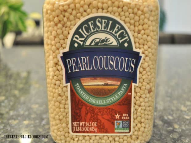 A container of pearl couscous (also known as Israeli couscous).