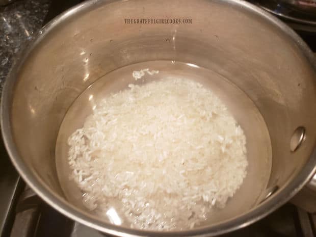 Long grain white rice is cooked in water until done and fluffy.