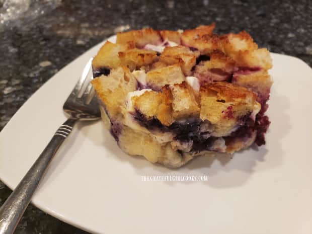 Each of the triple berry French toast cups is removed from ramekin and transferred to a plate.