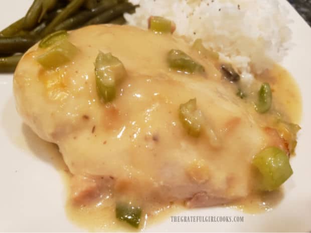 Yum Yum Chicken, topped with sauce and served with green beans and rice on the side.