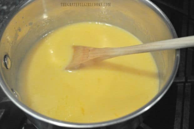 After cooking, the evaporated milk, sugar, butter, egg yolks and vanilla are creamy and yellow in color.