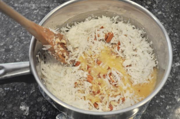 Coconut Pecan Frosting being stirred in the saucepan.