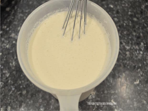 Milk, whipping cream, vanilla and sugar are whisked together for the ice cream.