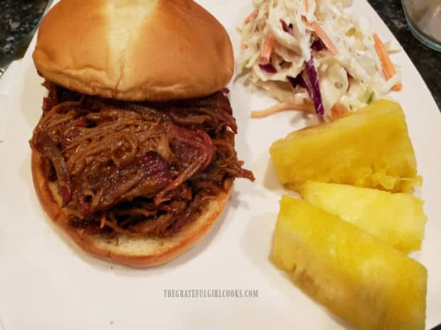 Smoked brisket of beef has been shredded then heated in bbq sauce for a delicious sandwich.