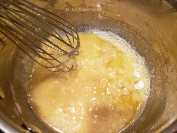 Butter, mustard powder and flour are cooked in saucepan to begin making the cheese sauce.