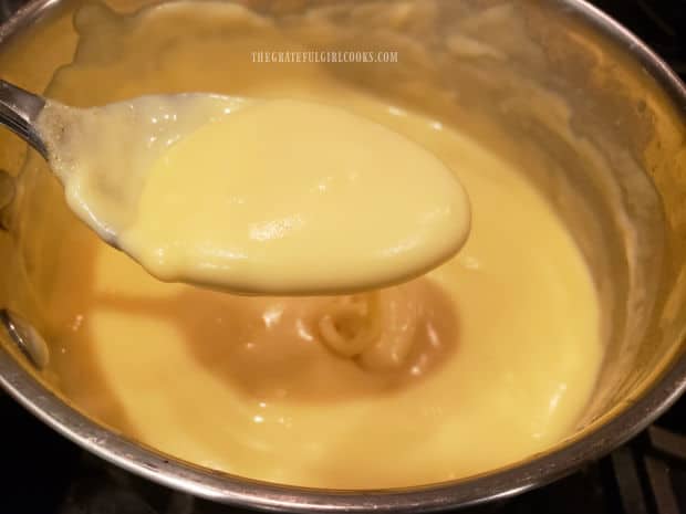The creamy cheese sauce is seasoned, then is ready to add to cooked macaroni noodles.