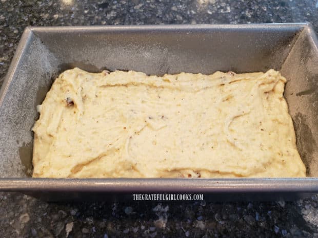 The batter for sun-dried tomato Parmesan bread is spooned into a greased/floured loaf pan