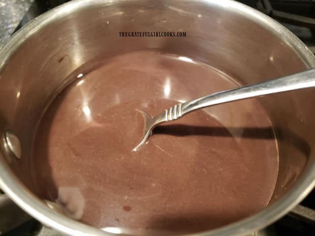 Milk, chocolate syrup, and brown sugar are cooked in saucepan until sugar dissolves.