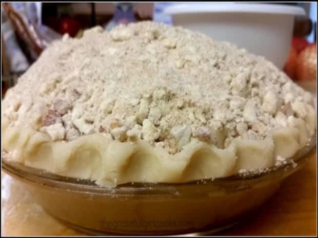 The streusel crumb topping is mounded from the crust into the middle of the pie.