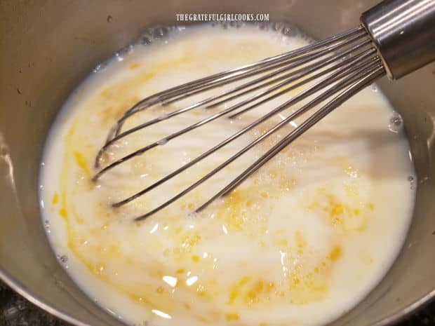 Eggs and buttermilk are whisked together in a separate bowl.
