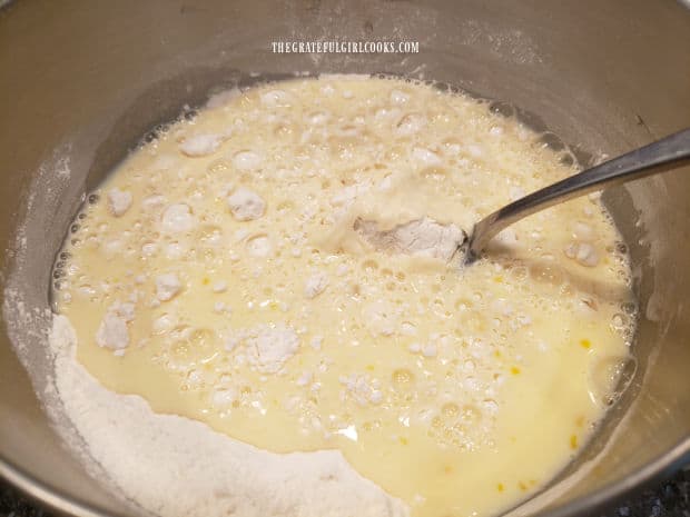 Wet ingredients are combined with dry ingredients to make batter for easy buttermilk pancakes.