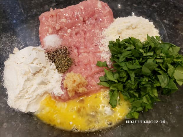 Ingredients for the Italian Chicken Parmesan Meatballs are placed in a large bowl before combining.