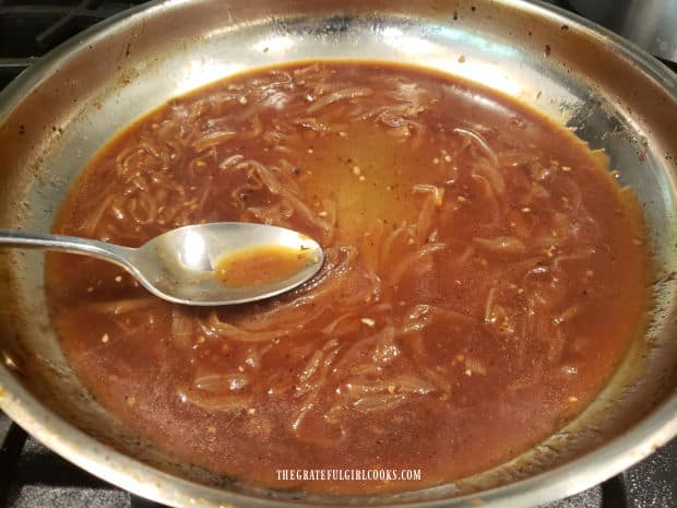 The onions are added back into the gravy and cooked until gravy thickens.