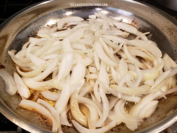 Sliced onions are cooked in butter until well browned.