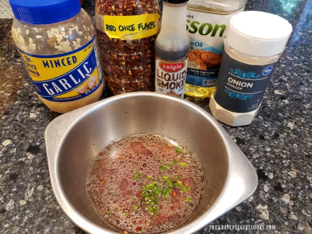 Ingredients to make the smoky grilled chicken marinade are mixed together in a bowl.