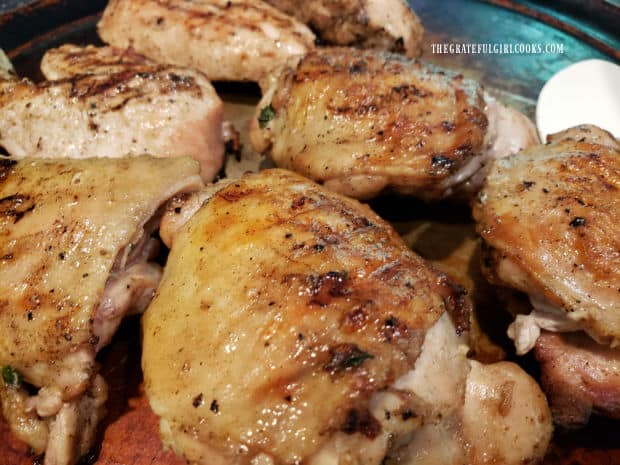 Grilled chicken thighs are ready to enjoy after marinating in sauce, then being grilled.