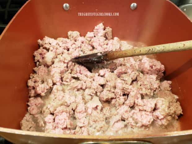Ground turkey is cooked until lightly browned and cooked through, in large saucepan.
