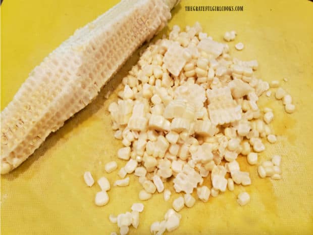 Corn kernels are sliced right from the cob to use in the TexMex Zucchini Squash Skillet.