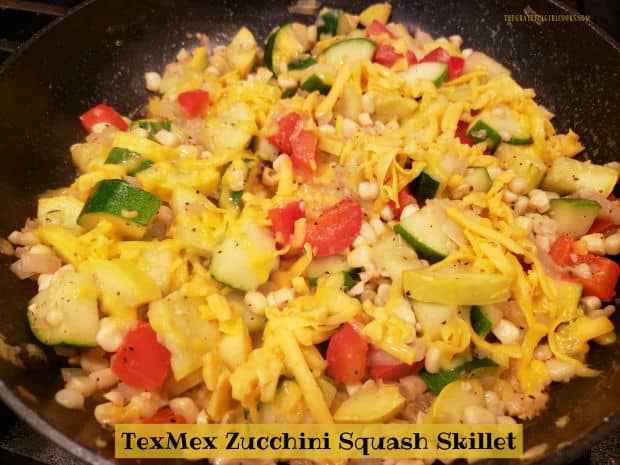 TexMex Zucchini Squash Skillet is a tasty, one pan dish with zucchini, corn, red bell pepper, onion, garlic and spices, topped with cheese! 