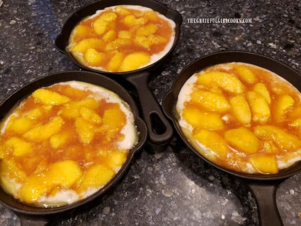 Peach filling is added to the top of the cobbler batter, but is not stirred in.