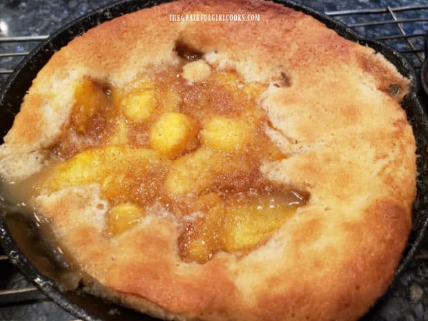 The peach cobbler is golden brown on top and the filling is bubbly once done baking.