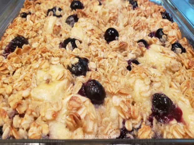 Close up of the baked oatmeal, full of juicy blueberries and sliced bananas.