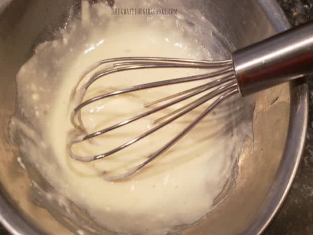 Flour is whisked into chicken broth to make a thickening agent for the chowder.