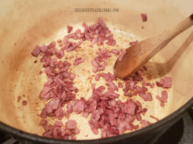 Small pieces of turkey bacon are cooked in soup pot until crispy.