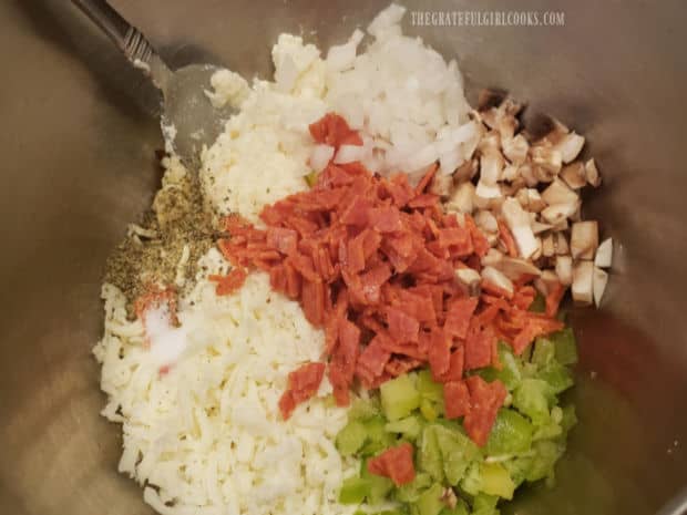 Onions, mushrooms, pepperoni, spices and 3 cheeses make up the calzone filling.