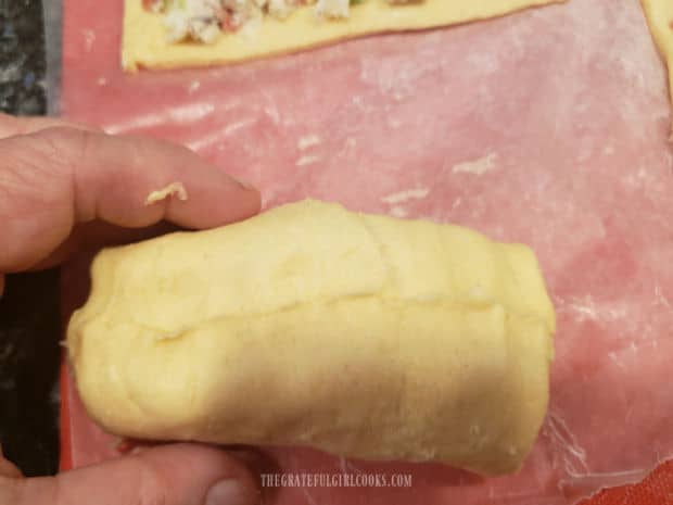 Seams are pinched together on the dough.