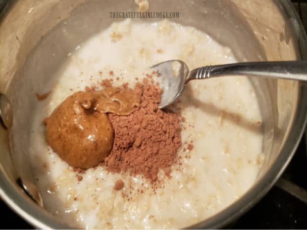 Maple syrup (or honey), cocoa powder and almond butter are added to the cooked oatmeal.