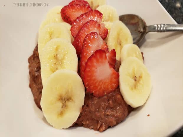 Slices of banana and strawberries are added to make it chocolate banana berry oatmeal.