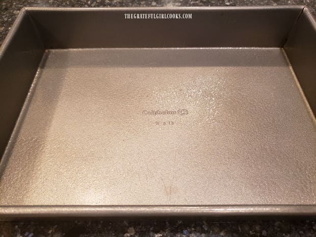 A 9x13 inch baking pan is greased on the bottom and sides before adding cooked gelatin mixture.