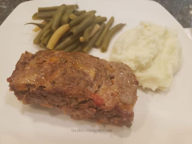 Creamy Garlic Mashed Cauliflower is served along with green beans and meatloaf.