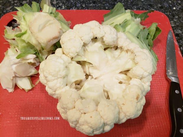 The core of the cauliflower is cut out of the underside (and then discarded)