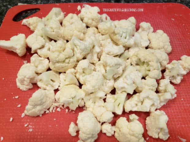 Cauliflower is cut into florets before cooking.