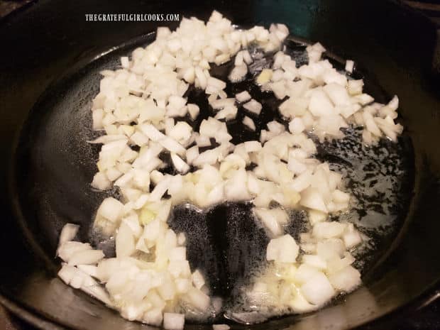 Chopped onions cooking in butter, in a large skillet.