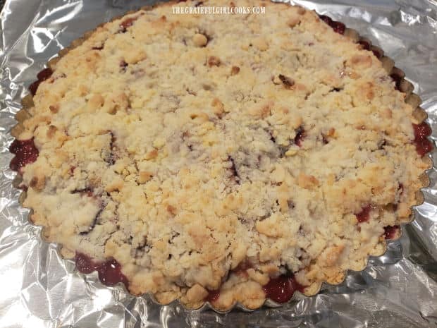 After baking, the Italian Plum Shortbread Tart is golden brown on top, and bubbly around edges.