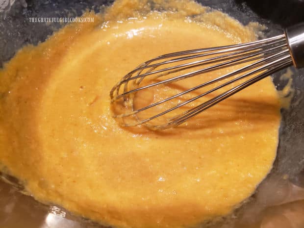 The wet ingredients for the muffins are whisked together until smooth.