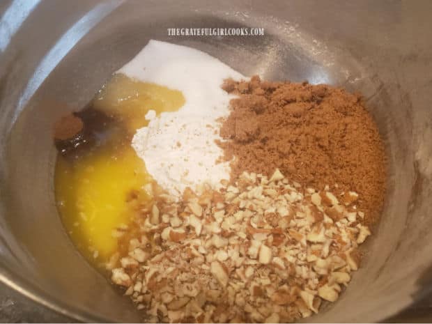 A streusel topping is made with butter, flour, brown sugar, granulated sugar, pecans, pumpkin pie spice and salt..