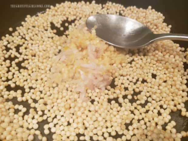 Shallots, garlic and lemon zest are added to the skillet with toasted pearl couscous.