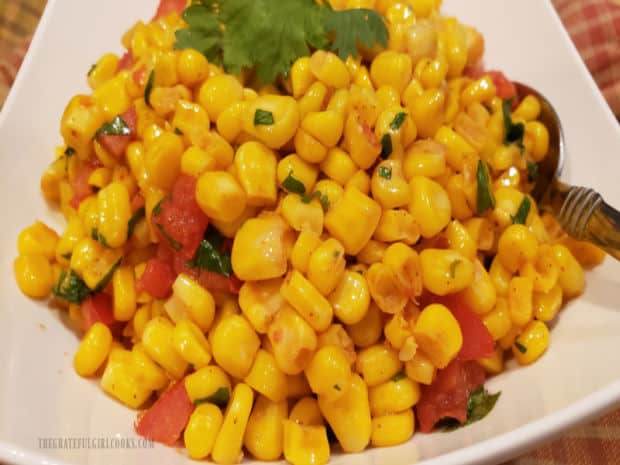 A close up look at the Southwestern skillet corn in a serving bowl.