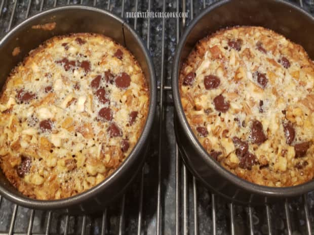 After baking 30 minutes, the chocolate caramel pecan tarts cool in the pan on a wire rack.