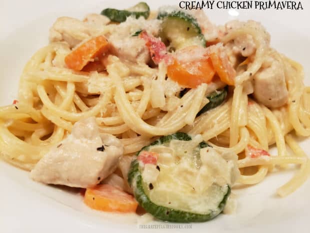 Creamy Chicken Primavera is an all in one dish, with chicken breasts, pasta, zucchini, carrots and onions in a velvety Parmesan cheese sauce.